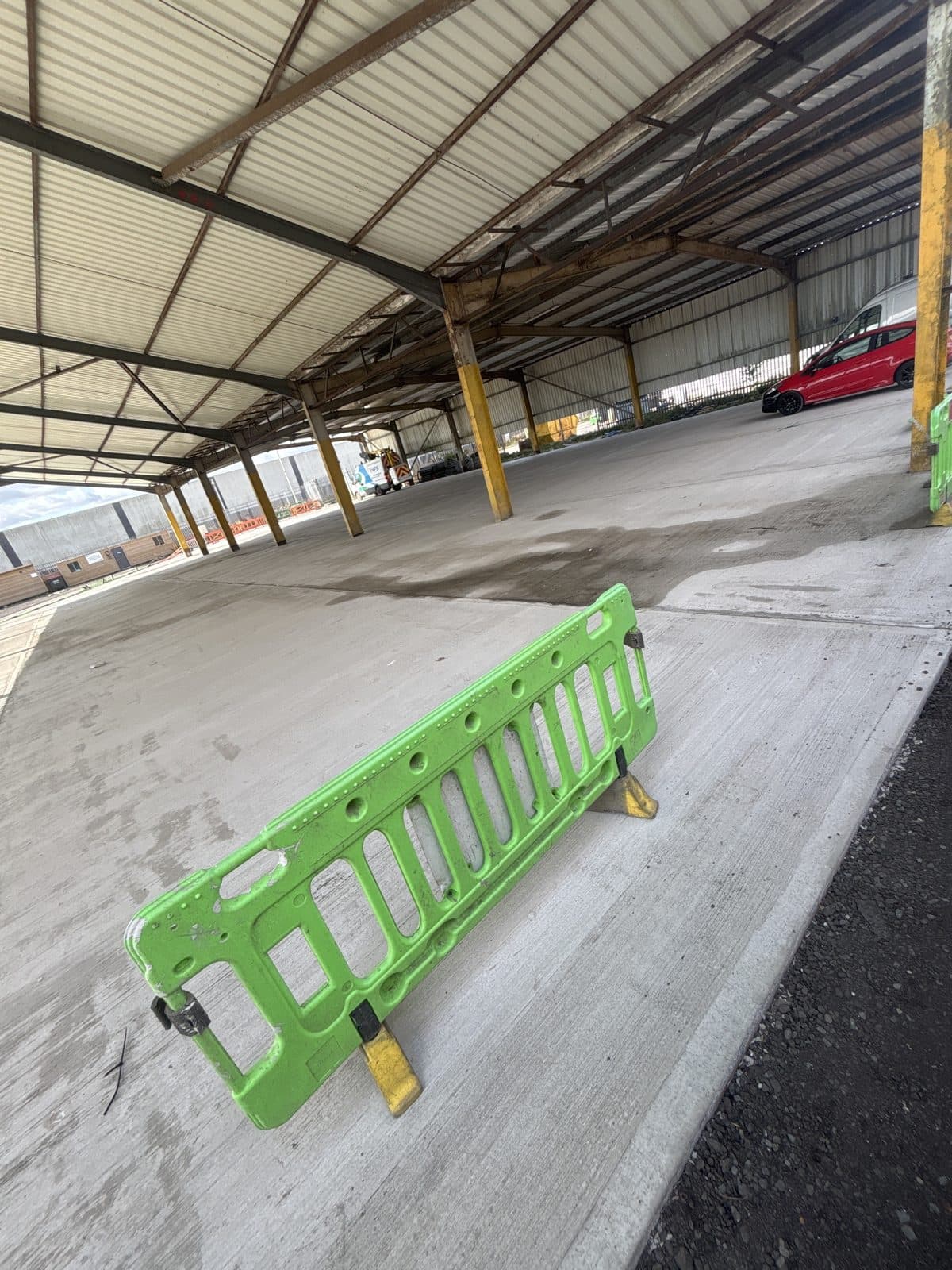 Concrete base being poured on an industrial site
